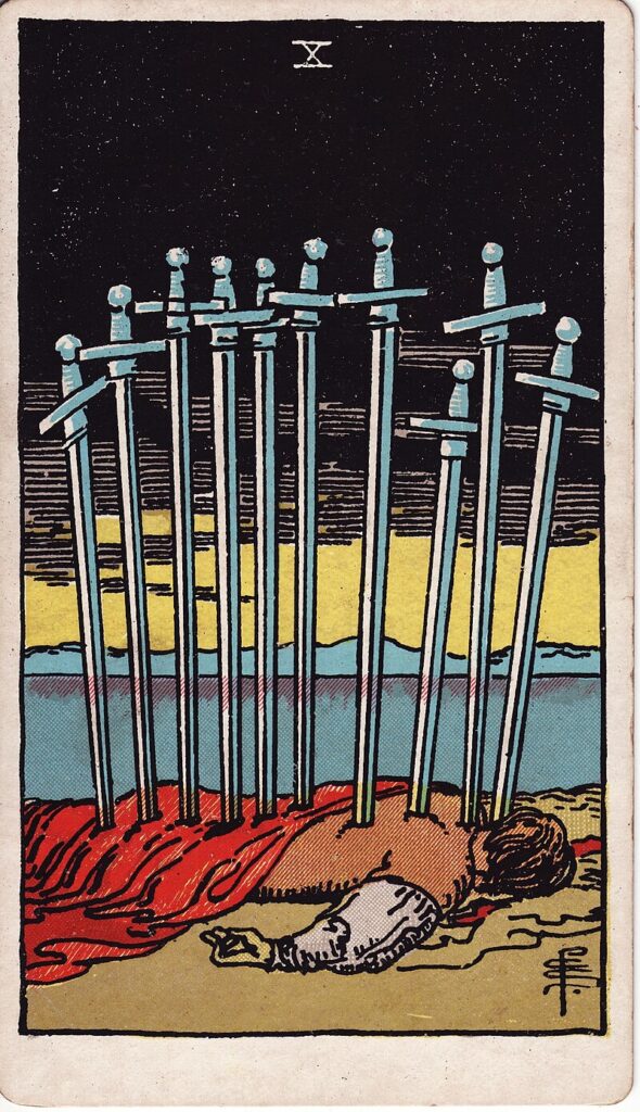 Tarotkortet Tio i svärd – en kropp ligger med tio svärd i ryggen under en dramatisk himmel – representerar slut, svek och total kapitulation.